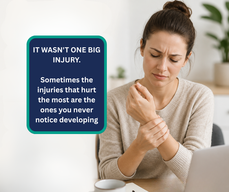 A woman holding her sore wrist - RSI